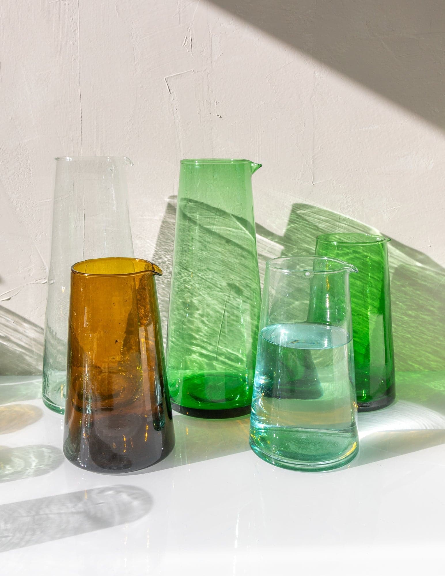 Beldi tapered carafes in clear, green and amber, in two sizes